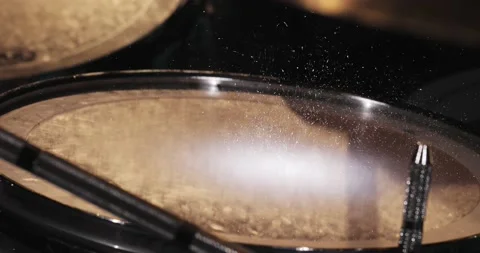 Hitting the snare drum with a drum stick, shiny dust jumps Stock Footage 177254463