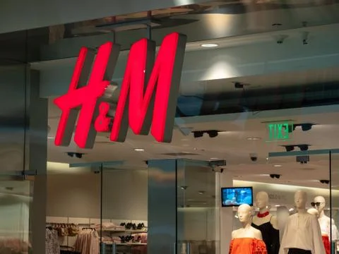H&amp;M logo on a storefront. Stock Photos