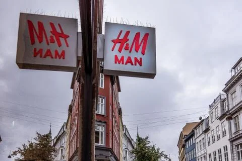 HM sign reflections in a window store Stock Photos