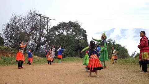 Hmong children playing "Con" throwing game Stock Footage 88978517