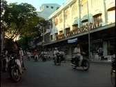 Ho Chi Minh City, Saigon, Continental Hotel, Motor Scooters Passing Stock Footage