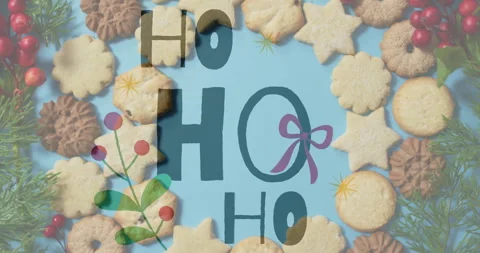 Ho text animation over Christmas cookies on blue background Stock Footage 306508356