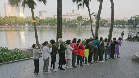 Hoan Kiem Lake group exercise, Hanoi, Vietnam, elderly women, VN Video stock 329724284