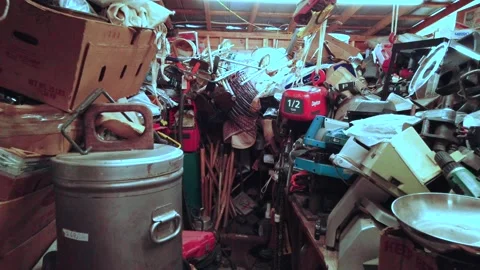 Hoarder displays many tools, scissors, pots, pans and bargain items Video stock 137765869