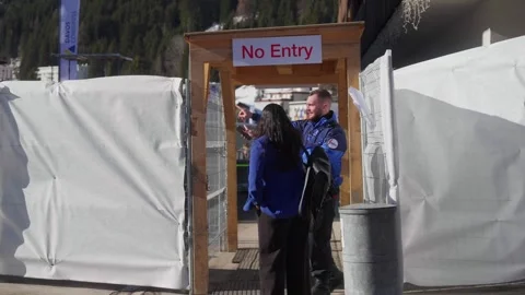 Hoarding and a No Entry sign during the build for the World Economic Forum Stock Footage 345299385