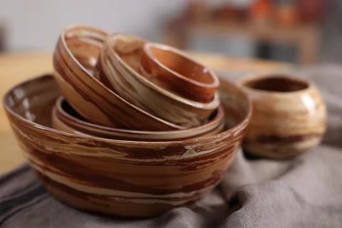 Hobby and craft. Stack of beautiful ceramic bowls on table indoors, closeup Stockfoto's