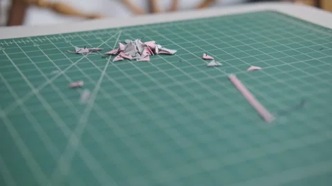 Hobby cutting board close up with shredded fabric Stock-Footage 306624201