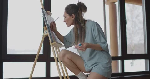 Hobby at home during self-isolation, woman artist is painting picture on canvas Stock Footage 170523029