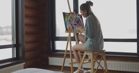 Hobby at home during self-isolation, woman artist is painting picture on canvas Stock Footage 170523075