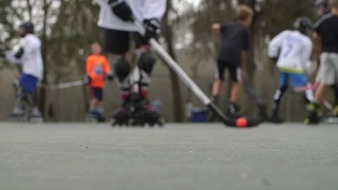 Hobby Kids inline skating skaters Roller Hockey game stadium sport court Stock Footage 86124198
