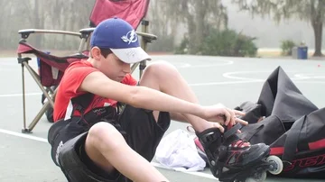 Hobby Kids inline skating skaters Roller Hockey game stadium sport court Stock Footage 86130845