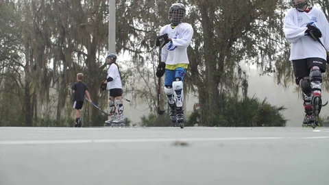 Hobby Kids inline skating skaters Roller Hockey game stadium sport court Stock Footage 86131380