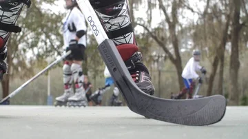 Hobby Kids inline skating skaters Roller Hockey game stadium sport court Stock Footage 86133859