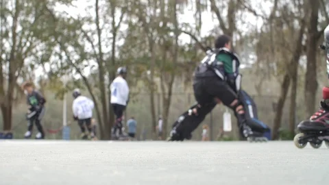 Hobby Kids inline skating skaters Roller Hockey game stadium sport court Stock Footage 86134096