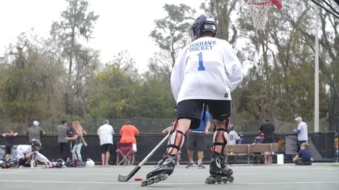 Hobby Kids inline skating skaters Roller Hockey game stadium sport court Stock Footage 86134327