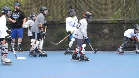 Hobby Kids inline skating skaters Roller Hockey game stadium sport court Stock Footage 86134622