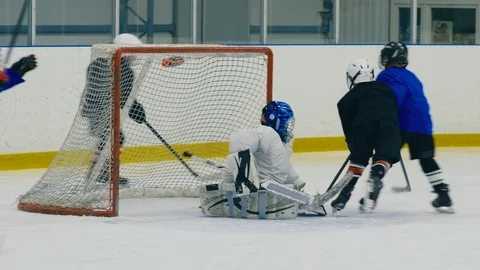 Hockey attack at the beginning of kid match Stock Footage 111341940