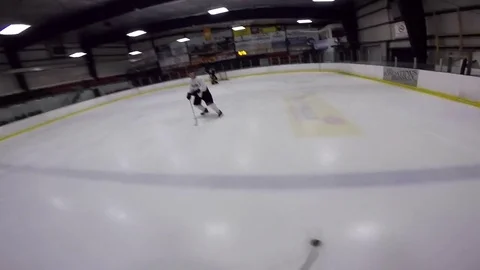 Hockey getting hip checked to the ice go pro helmet cam Stock Footage 71044065