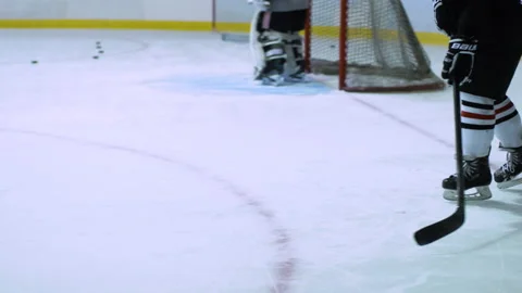 Hockey player stops and returns a puck during practice Stock Footage 130347410