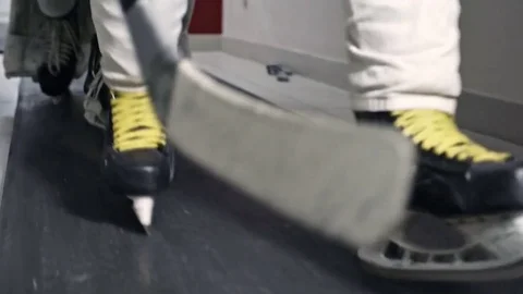 Hockey Players in Skates Walking on Rubber Flooring Stock Footage