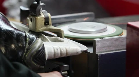 Hockey trainer sharpens skate Stock Footage 56861373