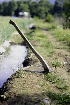 Hoe at The Edge of The Garden Stock Photos