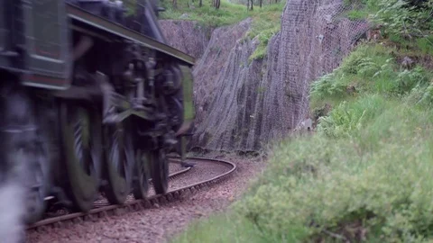 Hogwarts Express - The Jacobite - Disappears into Hillside Tunnel Scotland Stock Footage 84432073