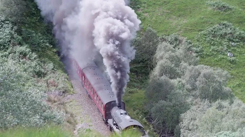 Hogwarts Express - The Jacobite Steam Train - in Cloud of Sooty Smoke Scotland Stock Footage 77094019