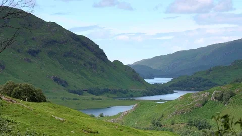 Hogwarts Express - The Jacobite - Steams through Scottish Glen Stock-Footage 77177190