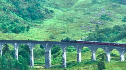 Hogwarts Express train crossing a bridge. Stock Footage 306642437