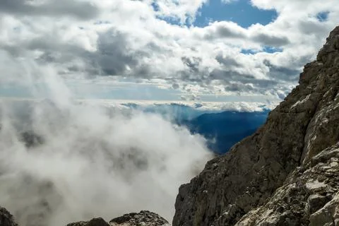 Hohe Warte - Clouds breaching through the high Alps Stock Photos