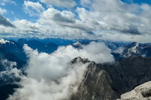 Hohe Warte - Clouds breaching through the high Alps Stock Photos