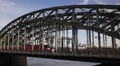 Hohenzollern Bridge Cologne People Walking Commuters Commuting Train Passing Day HD Footage
