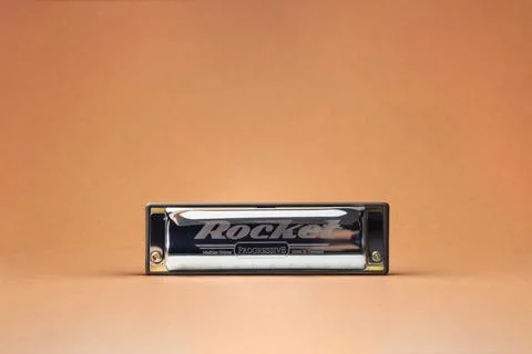 The Hohner Rocket professional diatonic harmonica stands at the forefront.  O Stock Photos