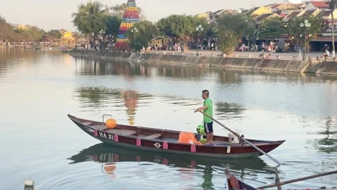 Hoi An Ancient Town with boatman rowing wooden sampan along Thu Bon River in Stock Footage 343326445