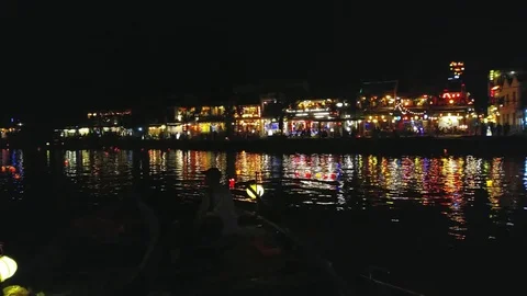 Hoi An, UHD handheld pan view of a colorful lanterns, infront of Hoi An city, Stock Footage 83836874