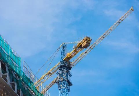 Hoisting crane at contstruction Stock Photos