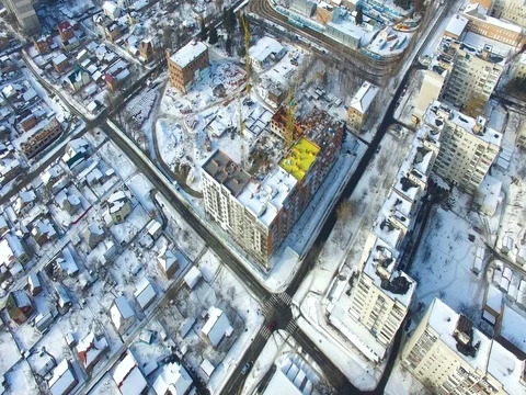 Hoisting cranes and building activity Stock Footage 81740865