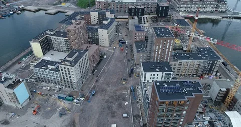 Hoisting cranes and new multi-storey buildings at day time. Stock Footage 114026471