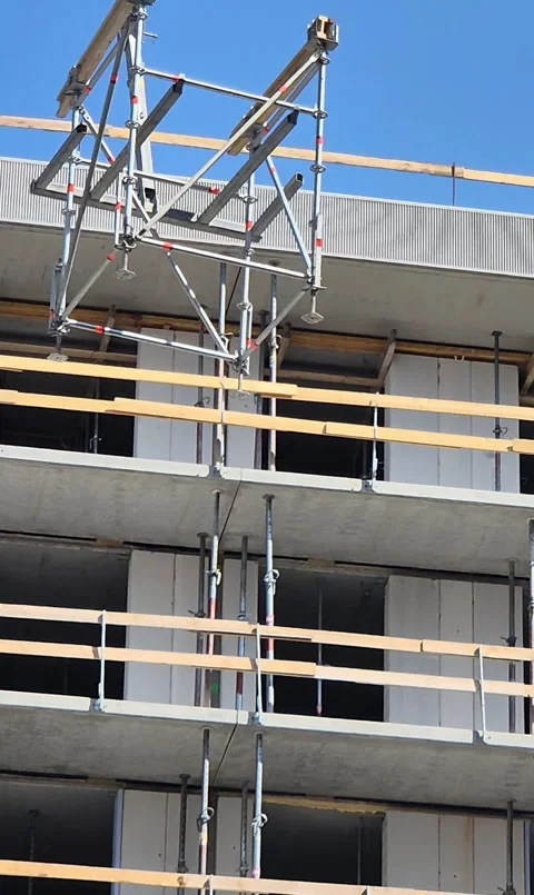 Hoisting down Staxo scaffolding structure with crane vertical video Stock Footage 340157354