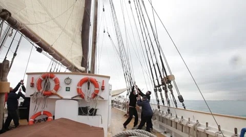 Hoisting sails on the deck of an ancient sailboat Stock Footage 51045125