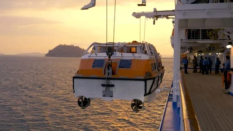 Hoisting tender boat into position aboard cruise ship Video stock 108199261