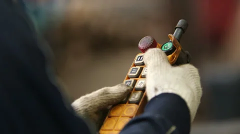 Hoisting a yellow remote control Stock Footage 33654186