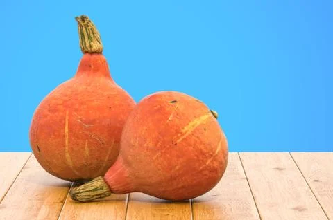 Hokkaido pumpkins close-up 3d rendering with realistic texture on the wooden  Stock Illustration