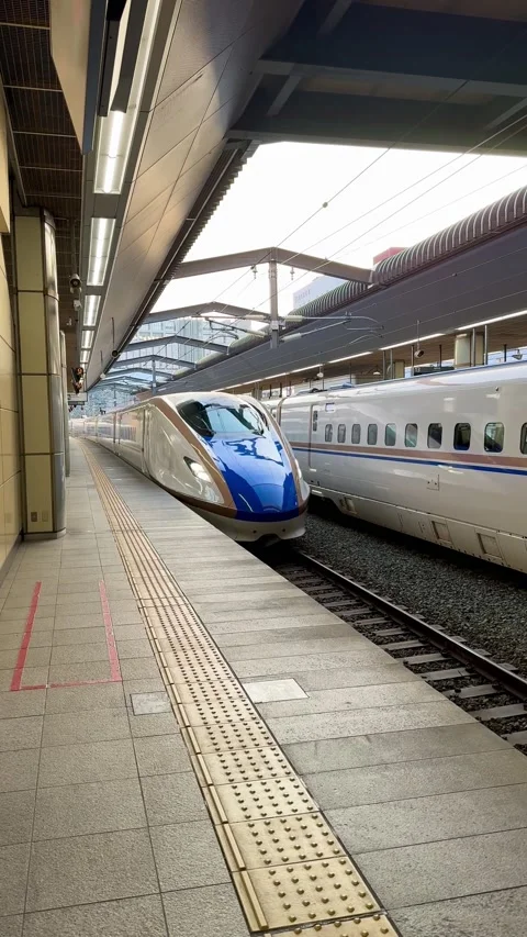 The Hokuriku Shinkansen pulls into the platform Stock Footage 278123608