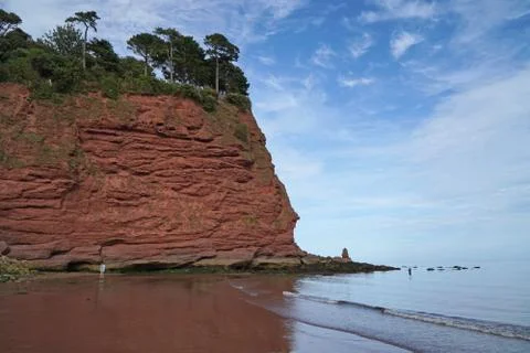 Holcombe Beach Devon with red sandstone cliffs Stock Photos