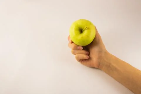 Hold an apple in hand on a white background Foto stock