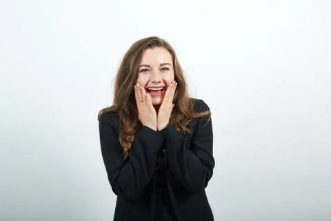 Hold arms hands cheeks cheekbones overjoyed palms touch chin charming smile. Stock Photos