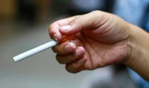 Hold cigarettes Stock Photos