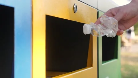 Hold hand crush empty bottle crumpled plastic garbage bin trash sorting Stock Footage 161763249